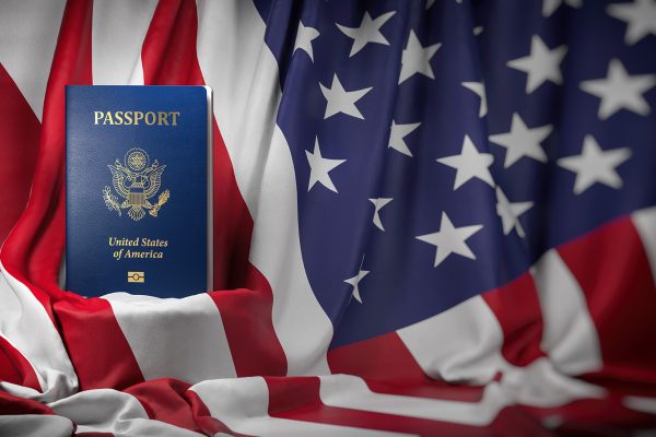 USA passport on the flag of the US United Stetes. Getting a USA passport,  naturalization and immigration concept. 3d illustration